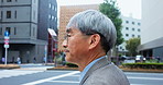 Walking, street and Asian businessman in city for morning commute, travel and journey. Professional, corporate worker and mature Japanese person crossing road in metro town for career, job and trip
