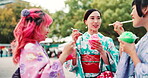 People, park and eating dessert at Japan festival with shaved ice slush drink, taste test and enjoyment in kimono. Traditional fashion, women and friends with kakigori for snack, talking and culture