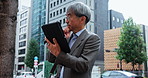 Mature businessman, thinking and tablet in city for planning, brainstorming and map app direction in Japan. Asian architect, man and tech in Tokyo for problem solving with ideas for urban development