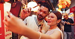 Asian couple, market or selfie with food, skewers or kebabs for traditional or local cuisine in Japan. Japanese, man and woman with picture, photography or memory for omoide yokocho together in Tokyo