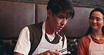 Japanese man, woman and recipe for healthy dish, food and traditional cuisine as couple in cafe. People, aroma and ramen noodles as culinary culture, dinner and meal prep with smell, eating and taste