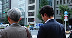 Japanese, business people and men with walking in city, travel journey and commute to workplace. Urban, sidewalk and corporate employees with conversation in morning, downtown and lawyers in Tokyo