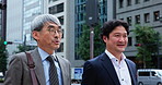 Walking, talking and team with business people in Japan city for mentor, conversation and client negotiation. Partnership, corporate and travel with men in outdoors for discussion and collaboration
