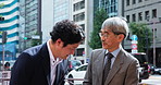 Japanese, businessmen and meeting with bow for conversation, introduction or chat in city. Asian men, employees or colleagues talking with respect for business tradition on street sidewalk in Japan