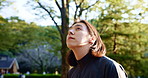 Face, fitness and thinking with man at forest for health, sports or wellness routine in summer. Exercise, planning and vision with Japanese athlete or runner in nature park for training and workout