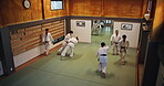 People, students and practice in dojo for karate, kung fu and training with fitness, fight and battle. Martial arts, discipline and workout for exercise, class and self defense with combat in Japan