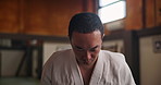 Face, proud Asian man or bow in dojo for respect, karate practice and self defense in class. Portrait, honor or student in Japan for learning martial arts, combat training or workout for fighting