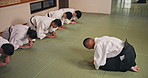 Aikido, martial arts and bow in class, respect and karate with gratitude, appreciation and training. Japanese people, group and students with instructor, ritual and fitness with sensei and education