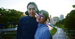 Japanese couple, face and smile outdoor, date and hug together with partner on bridge at sunset. Asian man, woman and portrait in city for travel, support and connection for love with wind in Tokyo