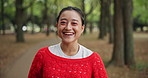 Face, funny and woman in forest, happiness and adventure with nature, laughing and Japan. Portrait, Asian person and girl in woods, journey and travel with environment, humor and smile with pride