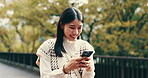 Woman, phone and park for laughing in Japan, travel and tourist in garden for sightseeing. Female person, reading funny message and online for communication, texting and vacation for internet update