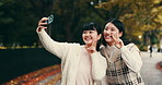 Japanese women, friends and selfie with peace sign for happiness, outdoor and playful. Female people, bonding together and smile as post for memory, fun and social media app in park, garden or nature