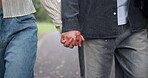 Couple, walking and holding hands for love, relationship and romance outdoor on road in Japan. Man, woman and people in street for travel, bonding and valentines day with support, partner and date