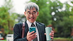 Phone, coffee and mature businessman in city for social media, internet and message on morning commute. Travel, corporate and happy Japanese person on smartphone for contact, online email and website