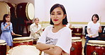 Japanese, women and teacher with drum class for taiko tradition, culture or practice. Portrait, asian musician or female person in confidence for music lesson, sound or percussion instrument in Japan