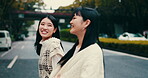 Women, walking and cross road in city of Japan, talking and friends travel together in town. People, conversation and adventure or urban journey on street, relax and outdoor hangout for bonding trip