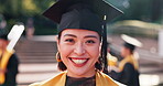 Face, happy and woman at graduation outdoor for education achievement, university certificate and future. Excited, girl and student with hat for celebration, study success and academic event in Japan
