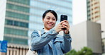 Woman, phone and photography in city on travel with smile for buildings, skyscraper or architecture in street. Person, smartphone and happy for memory, tourism and explore on urban sidewalk in Japan