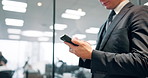 Hands, phone and person in office on network in corridor, contact or reading notification at company. Japanese employee, smartphone and texting for feedback with mobile app at insurance agency