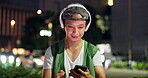 Man, headphones and dancing at night in city, phone and streaming online for playlist on site. Male person, relax and outdoor music for peace in Japan, sound subscription and internet for audio