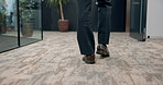 Businessman, legs or walking with shoes at office for movement, motion or commute in corridor. Closeup, man or feet of employee strolling on floor at workplace for career, job or business opportunity