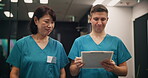 Walking, teamwork and nurses with clipboard for hospital, checklist and medical information while talking. Healthcare, surgeon and intern with document for diagnosis, review or filling forms in Japan