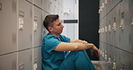 Crying, fear and doctor with man in locker room for depression, mental health and frustrated. Burnout, fatigue and bad news with person in Japan hospital for medical emergency, mistake and fail