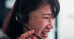 Woman, talking and headset in call center for customer service, CRM and consulting in Japanese office. Mature agent, face and tech in agency for telemarketing, IT support and feedback in closeup