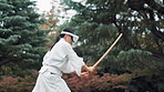 Bamboo, sword and virtual reality with Japanese woman in forest for metaverse exercise or training. Aikido, uniform and VR headset with Ninja or Samurai person outdoor in nature for culture or skill