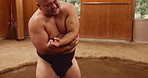 Japanese, man and sports with shoulder pain for fitness, sumo training and bone injury for wrestler. Dohyo, male person and fighter with arm ache for workout, traditional exercise and muscle tension