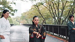 Japan, student and training with sensei, learning and exercise with fitness, help and practice. Instructor, karate and weapon in park, workout and outdoor with energy, wellness and mentor with advice