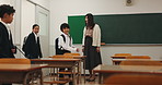School, walking and Asian children in classroom in morning for studying, education and learning. Academy, campus and Japanese teacher with happy kids greeting for lesson, development and knowledge
