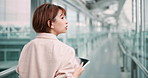 Tablet, business woman and walking in company for networking, back or flight notification at airport. Digital technology, work and Japanese person on internet, think or travel agent with booking app