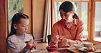 Dinner, mom and daughter with chopsticks, teaching and nutrition with food, parent and healthy in home. Supper, child and learning to eat, woman and meal for family, bonding and talking in Japan