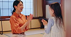 Japanese mom, child and clapping game in home for learning, coordination development and culture tradition. Family, girl or happy in living room with heritage, dexterity or laugh for mistake with mom