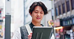 Man, tablet and travel in city with app, notification or texting with connection for social media on commute. Person, touchscreen and scroll on web, contact or booking taxi on urban sidewalk in Japan