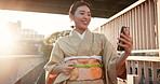 Happy, asian woman and video call with phone in kimono for fashion, travel or style in city. Japanese, female person or tourist with smile on mobile smartphone for online conversation or heritage