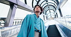 Man, thinking and escalator in city for travel, journey and kimono for Japanese fashion. Asian person, below and lift in airport with indigenous style, heritage pride or culture attire in urban Tokyo
