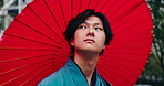 Umbrella, thinking and Japanese man in city with kimono, fashion and traditional clothes on street, Tokyo, morning and parasol with holiday, trip and travel on journey and vacation outdoor with view