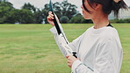 Japanese woman, training and archery for sport, equipment and club with recurve bow as athlete.  Female person, safety and outdoor in fitness center for target practice, competition or shooting range