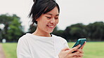 Outdoor, athlete and woman with smartphone, laughing and funny videos on social media, break and field. Watching, comedy and Japanese person with mobile app for entertainment, archer and Japan