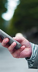City, phone and hands of businessman typing for social media, communication and networking. Professional, corporate and worker on smartphone for contact, online website and email message in Japan