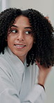Woman, comb and brush hair in bathroom with natural wellness, curly texture and growth results. Female person, mirror and reflection with cosmetic maintenance, scalp treatment and aesthetic at house