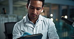 Scientist, man and writing notes with test tube, stats and check progress with pharma project in lab. Person, container and thinking with book for drugs, vaccine and medical research by microscope
