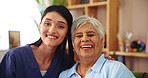Happy, face and old woman on sofa with nurse for senior care, support or smile in lounge at nursing home. Homecare, elderly person and caregiver embrace on couch for healthcare service in living room