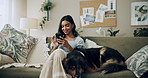 Home, dogs and woman on sofa, smartphone and social media with connection. Typing, apartment and happy girl on couch, best friends and pet with cellphone, message to contact and relax in living room