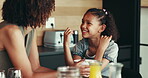 Woman, child and conversation in family home for support, bonding together and care as loving parents. Female person, girl and laugh at joke in kitchen for happiness, talking or connection as playful