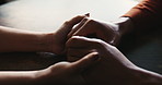 Holding hands, support and care for empathy, love and bonding together in home as romantic partners. People, compassion and feeling with help, solidarity and understanding in relationship or marriage
