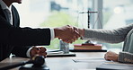 Hands, attorney and handshake with paperwork in office, agreement and review for compliance at company. People, lawyer and documents with consultation, contract and thank you at corporate law firm
