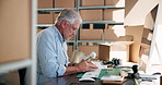 Typing, computer and mature businessman for distribution, supply chain and delivery for ecommerce. Warehouse, manufacturing and person with inventory report for logistics, planning and shipping boxes